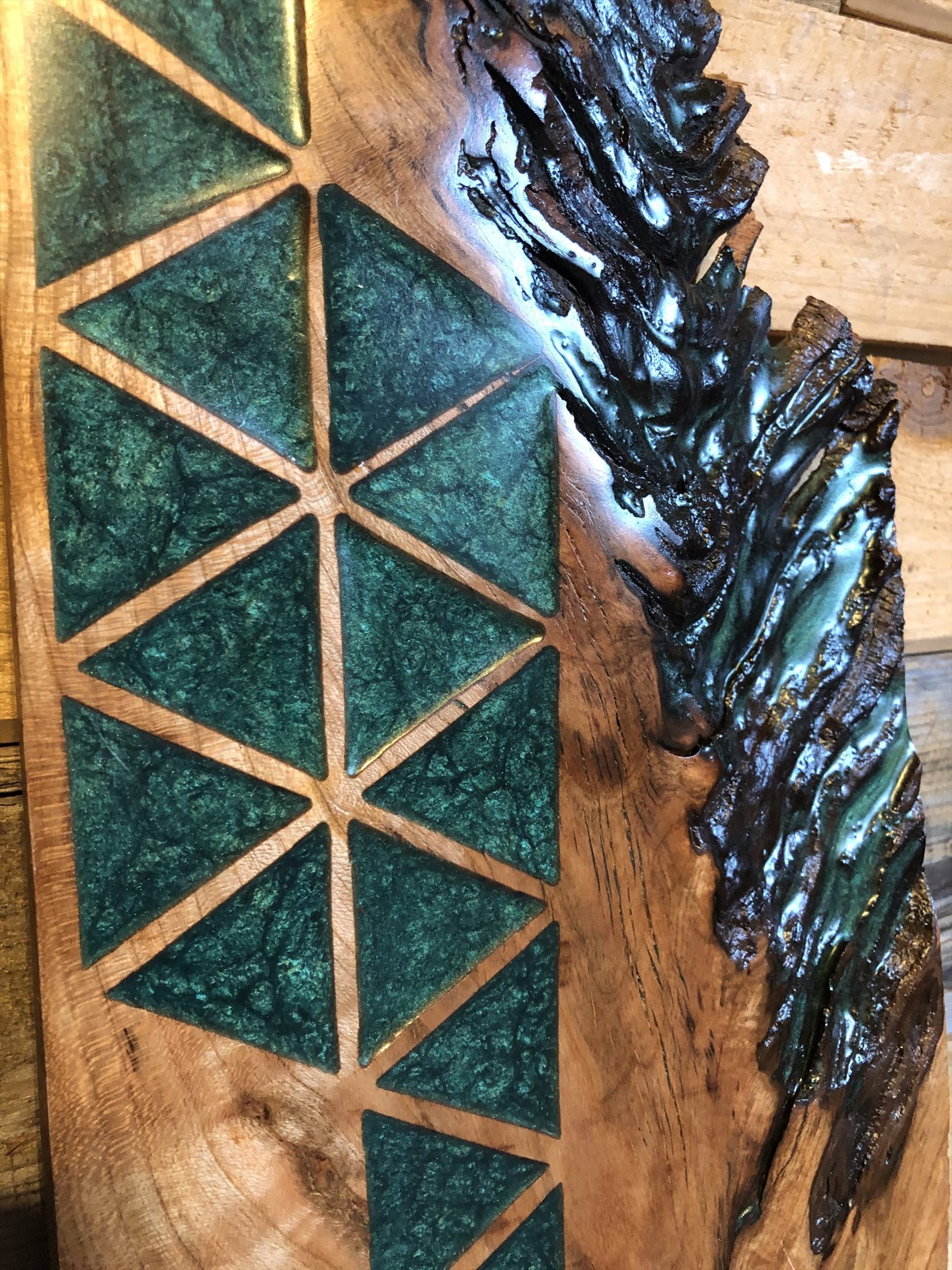 Green geometric resin inlay in natural-edge wood