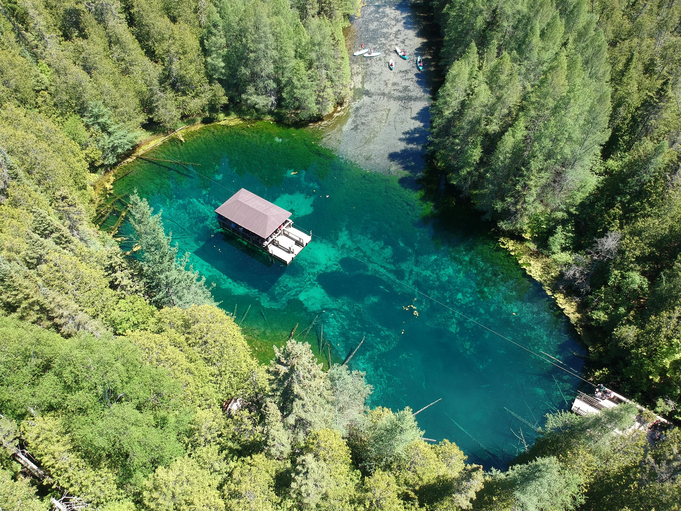Aerial view of the emerald-blue Kitch-iti-kipi natural spring near Manistique, Michigan