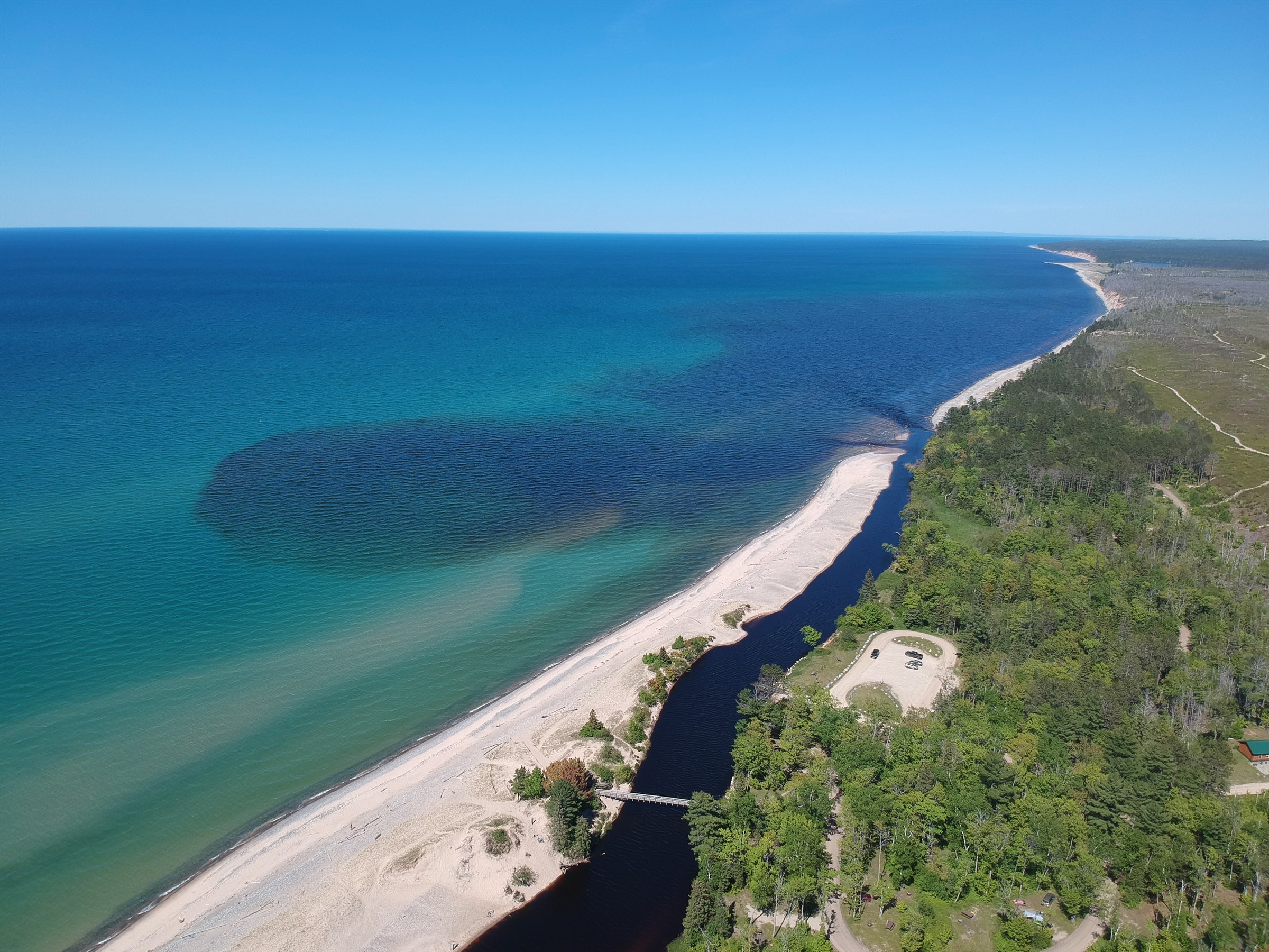 Aerial view of the Two Hearted River entering Lake Superior along Michigan's Upper Peninsula shoreline